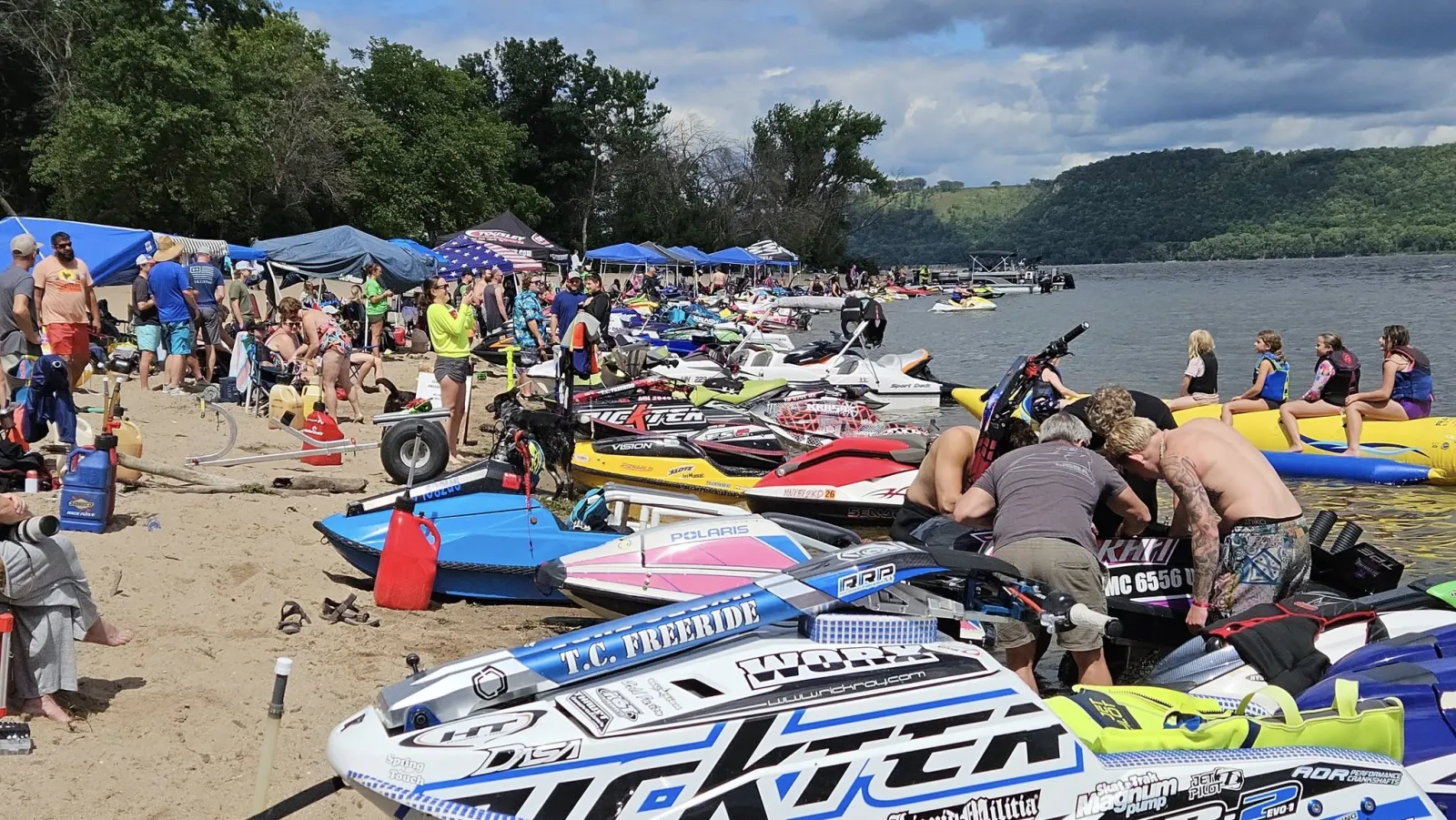 Jet skis lined up on the beach at Lake Pepin