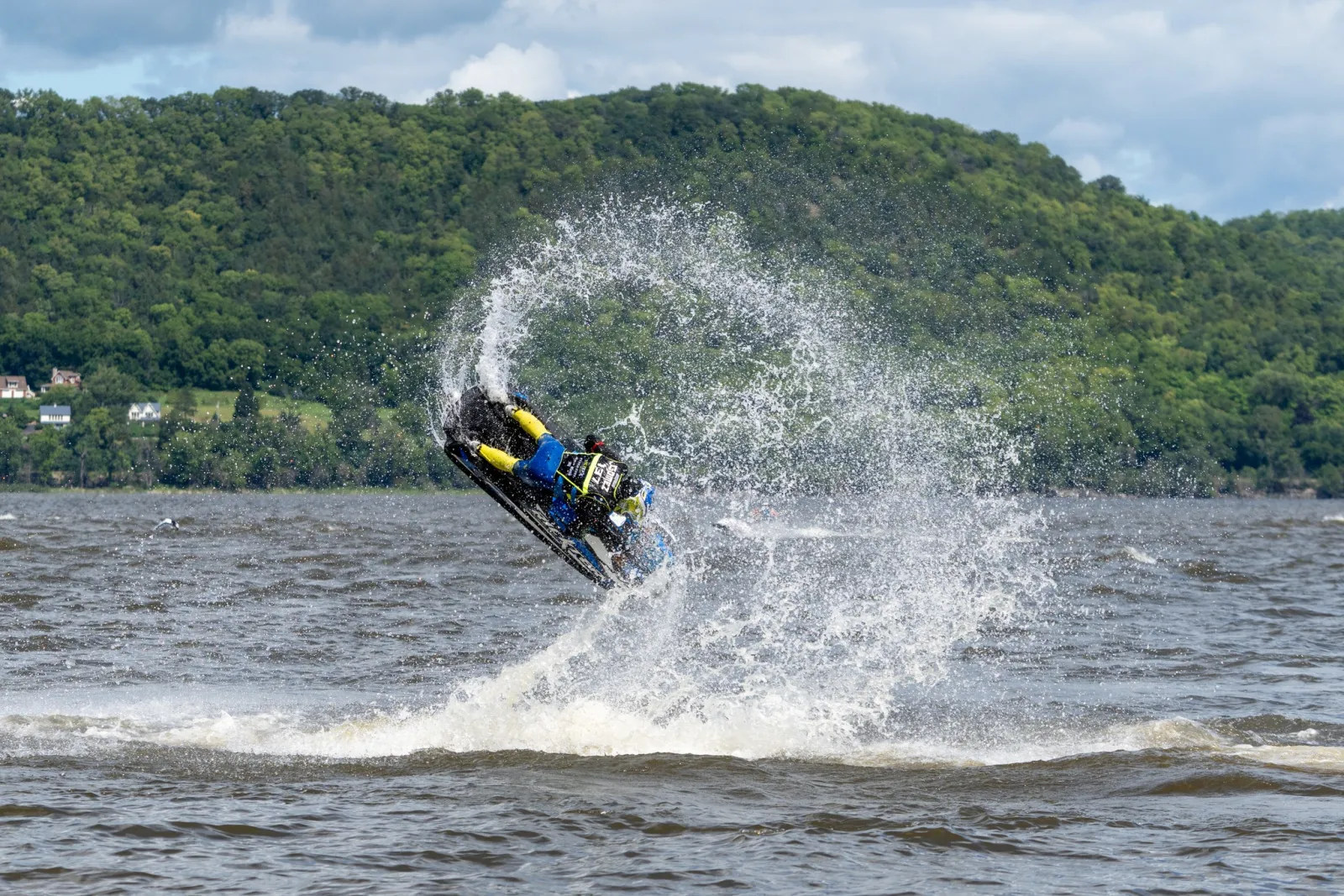 Rider mid-flip on a jet ski